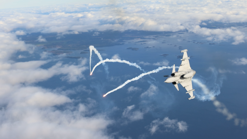 Fighter jet banking above the clouds, trailing smoke over a lake landscape