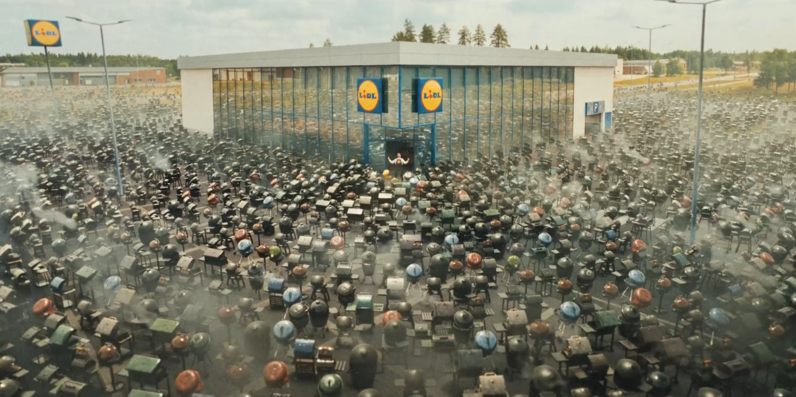 Thousands of barbecue grills filling a supermarket car park, a CG crowd-replication shot from the LIDL commercial