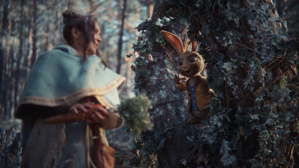 CG hare character on a mossy tree trunk meeting a cloaked woodsman in a forest, from the S-Market commercial